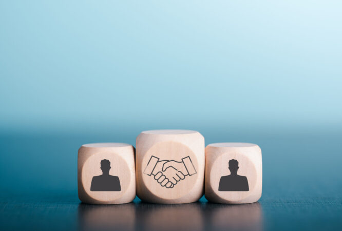 Wooden blocks laid on wooden floor, the concept of cooperation. teamwork Colleagues, friendship, unity, which is the strategy to develop the success of companies and organizations. to new innovation